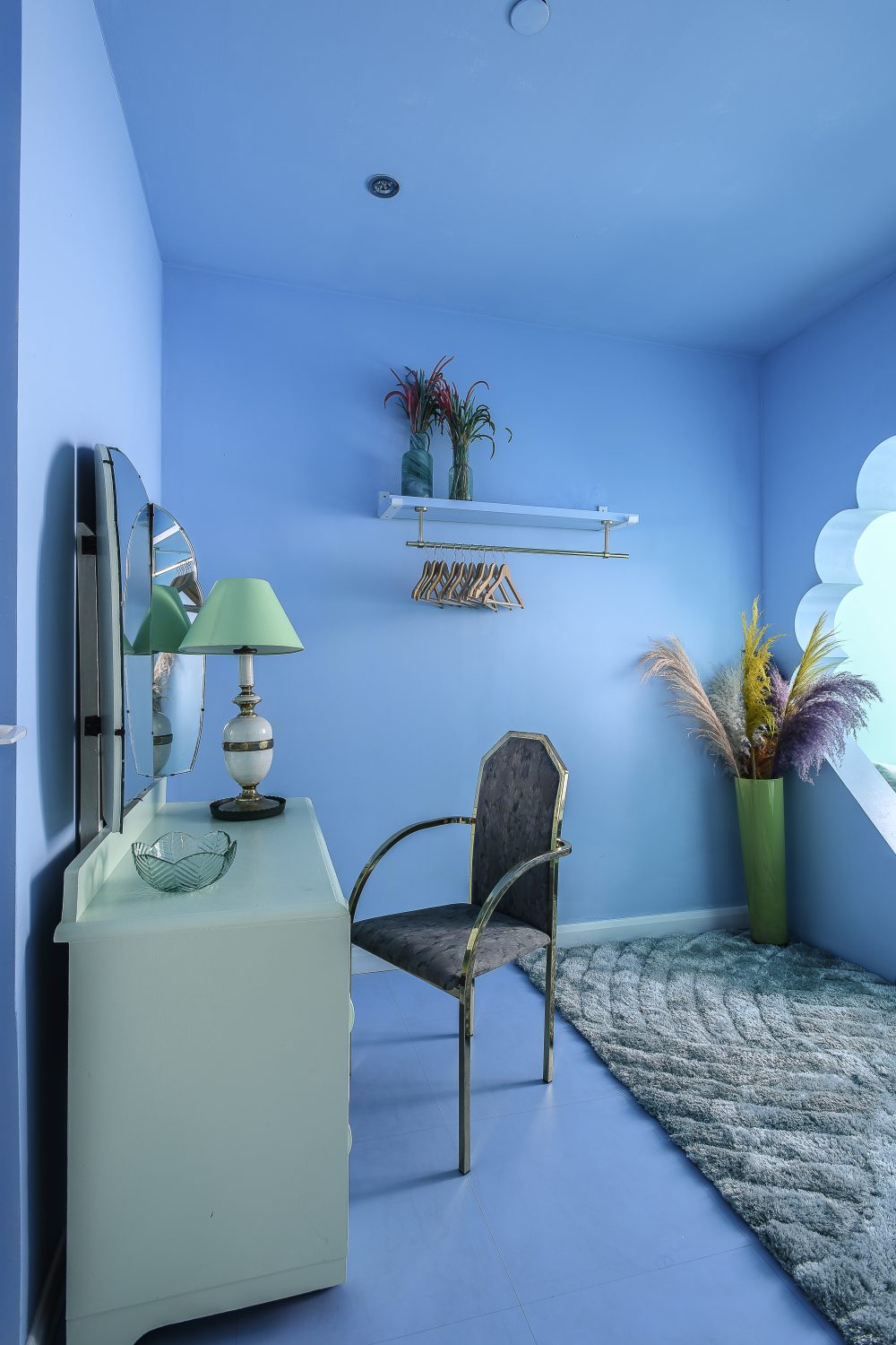 The rooms seem to glow from the inside out with coral pinks and orange in the main bedroom and aqua green and blue in the Mermaid Room, above