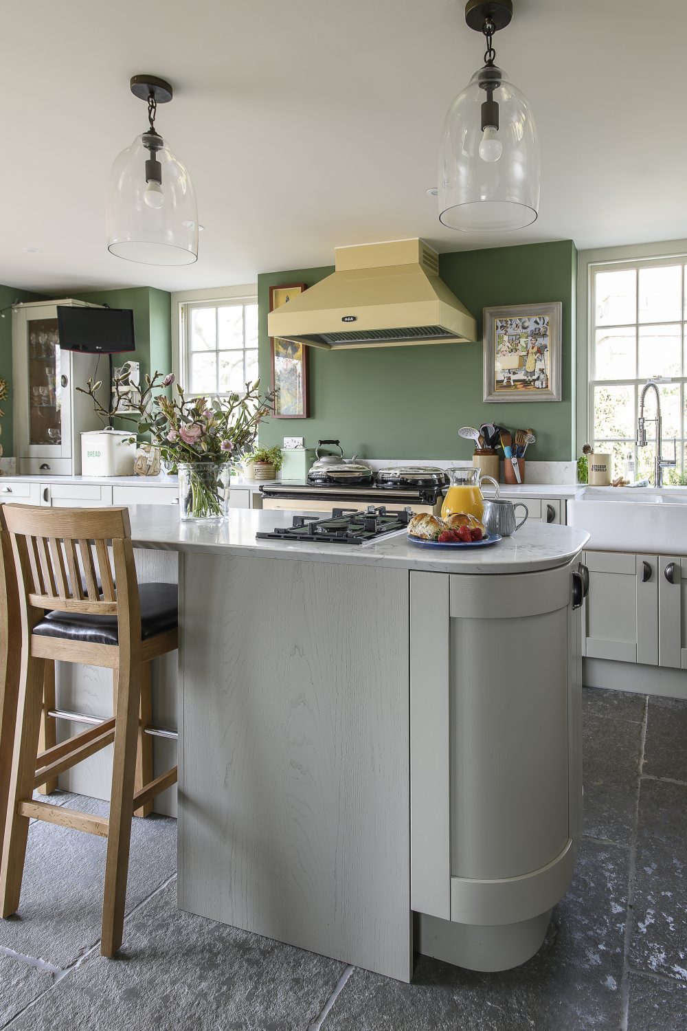 The new kitchen by Howdens spans across the back of the house and opens into the garden