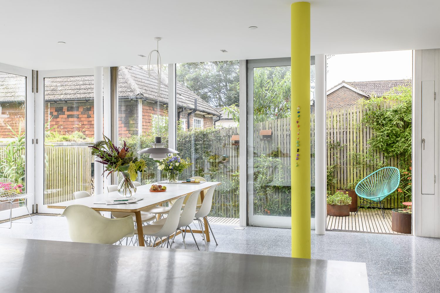 A wall of glass allows views over the paved and planted front garden