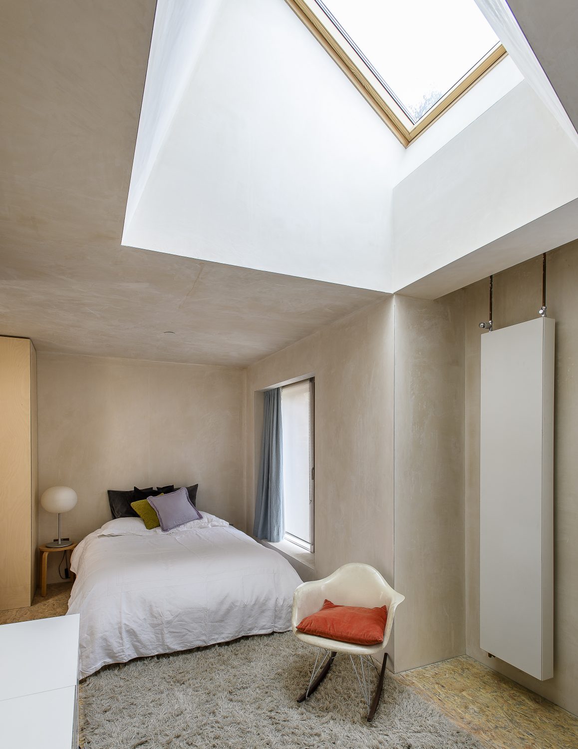 In the bedrooms on this floor plywood is also used to great effect in floor-to-ceiling wardrobe doors.