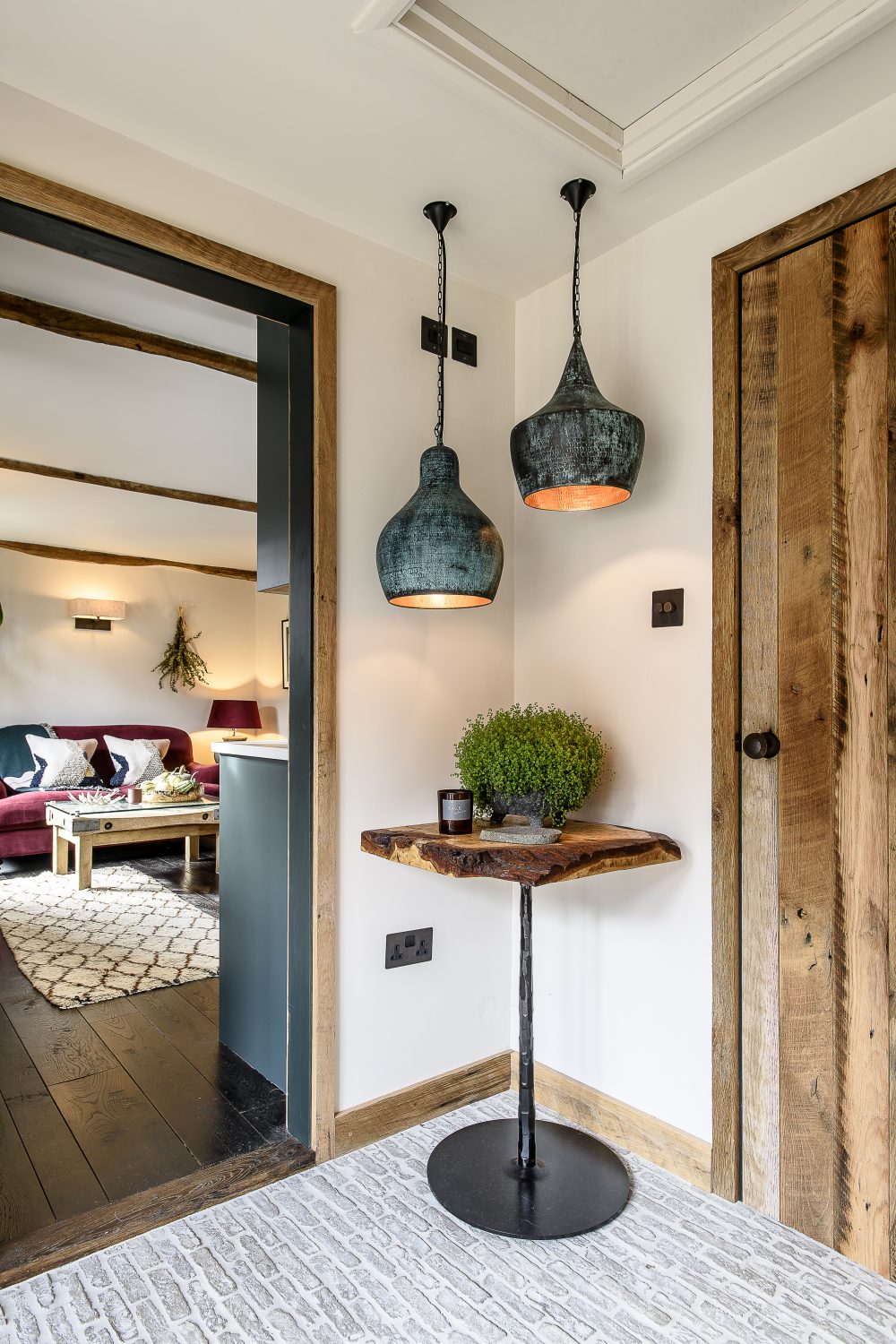 “All the doors are made from reclaimed Mississippi oak floorboards.” This gives them their rich warm colour and contrasts beautifully with the central section of the door frames, painted in a smokey blue