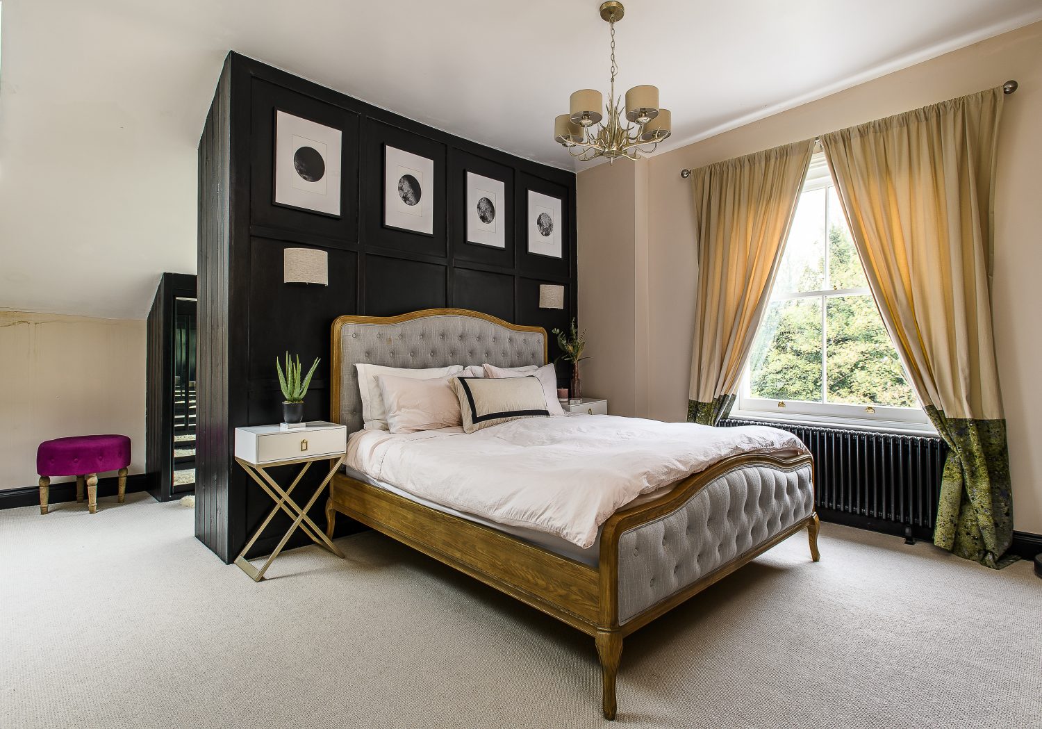 Three rooms were combined to create the master suite. A partition was put up behind the bed with mirrored wardrobe to make a dressing area with views over the back garden