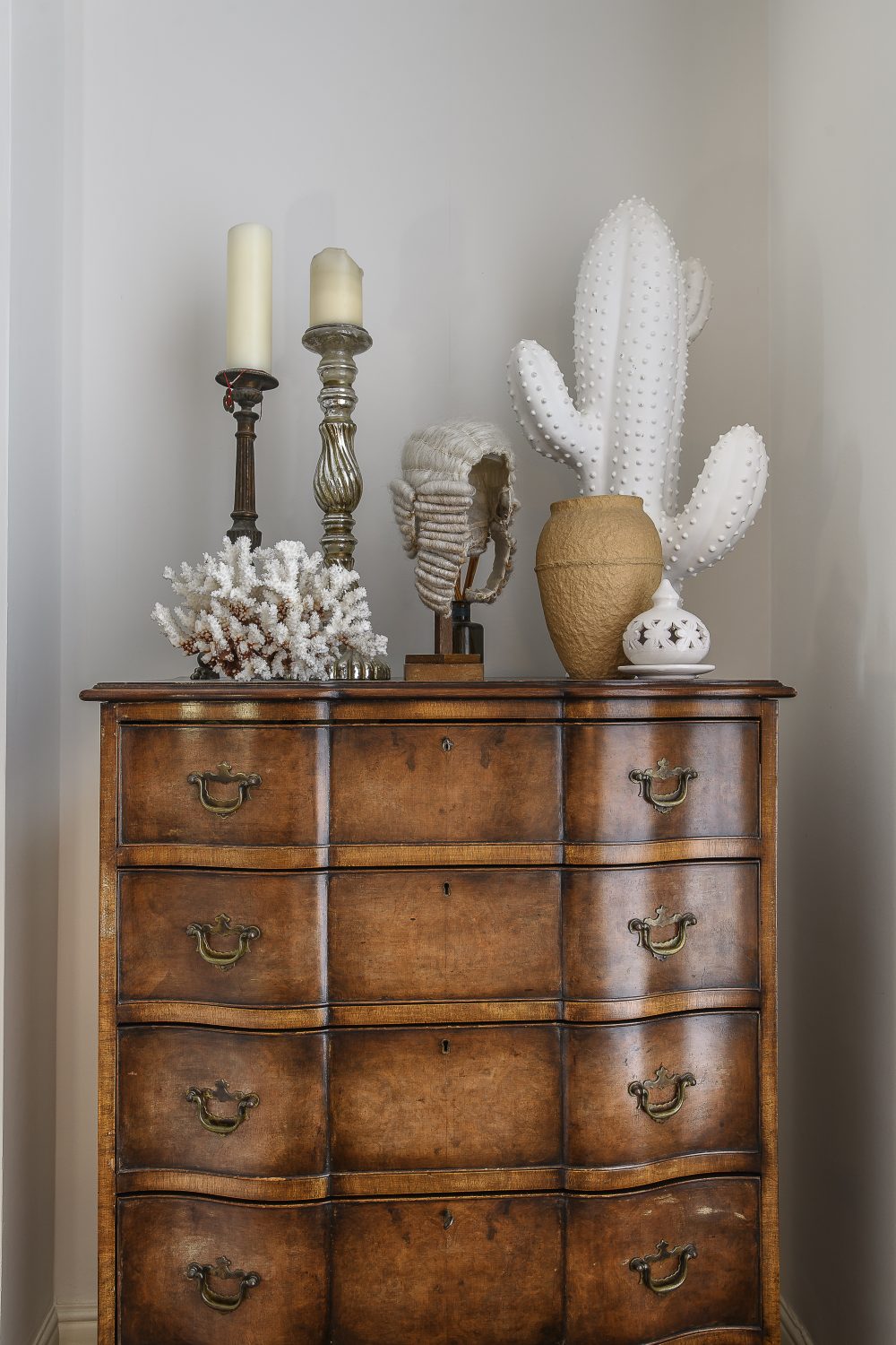 A large bow-fronted chest of drawers was bought at an antique depot in Bexhill Road