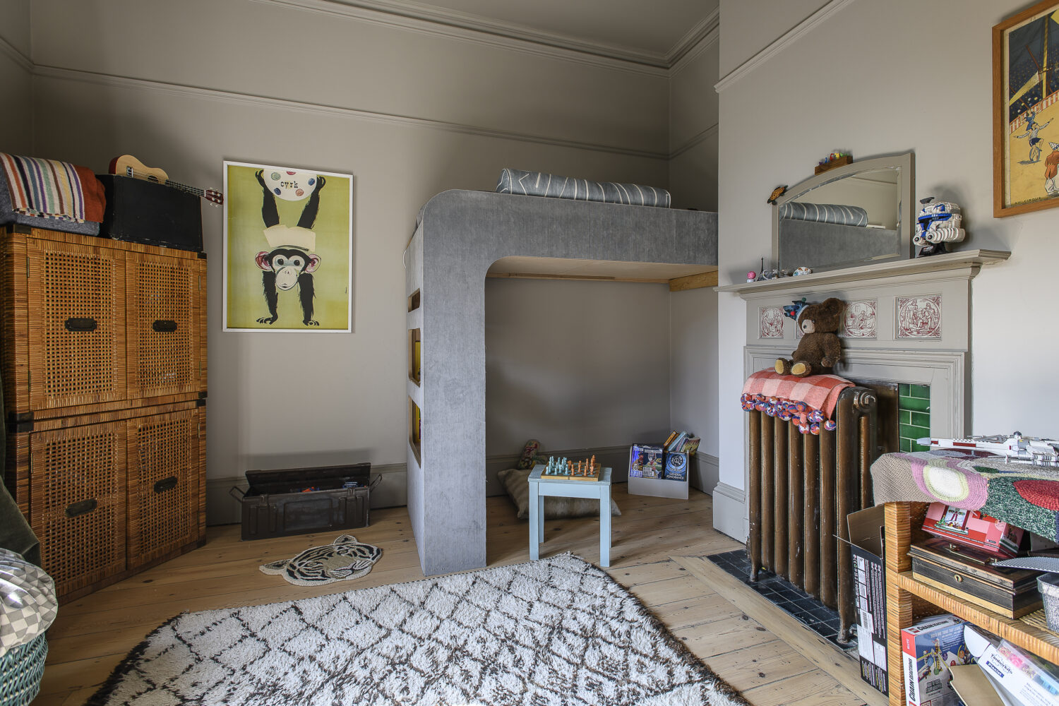 The boys’ spaces are designed for play and comfort, yet retain touches of Scarlett’s eye for design like the oversized ceiling lights and Ligne Roset sofa