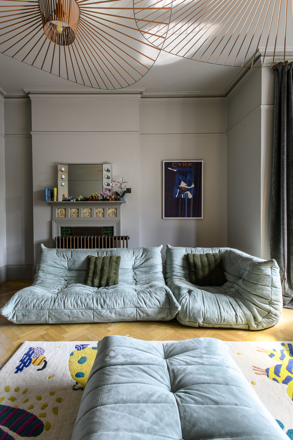 The boys’ spaces are designed for play and comfort, yet retain touches of Scarlett’s eye for design like the oversized ceiling lights and Ligne Roset sofa