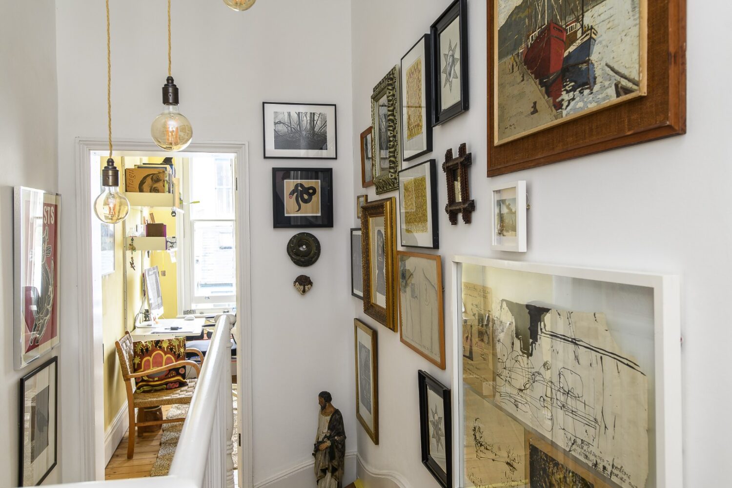 On the first floor, up the staircase lined with prints, paintings, drawings and curios