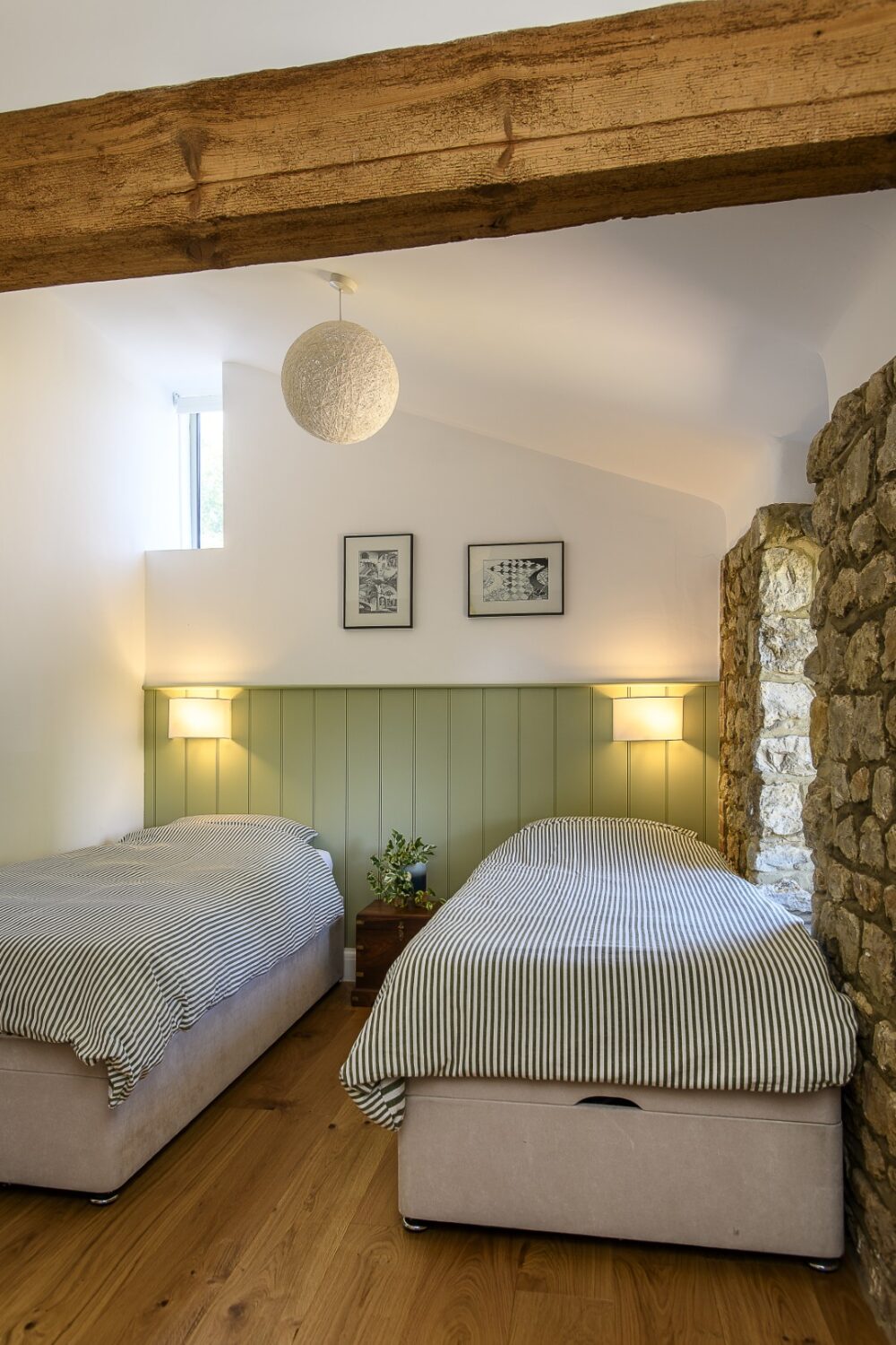 The external ragstone walls of the guest rooms have been complemented by panelling in soft yellow and sage