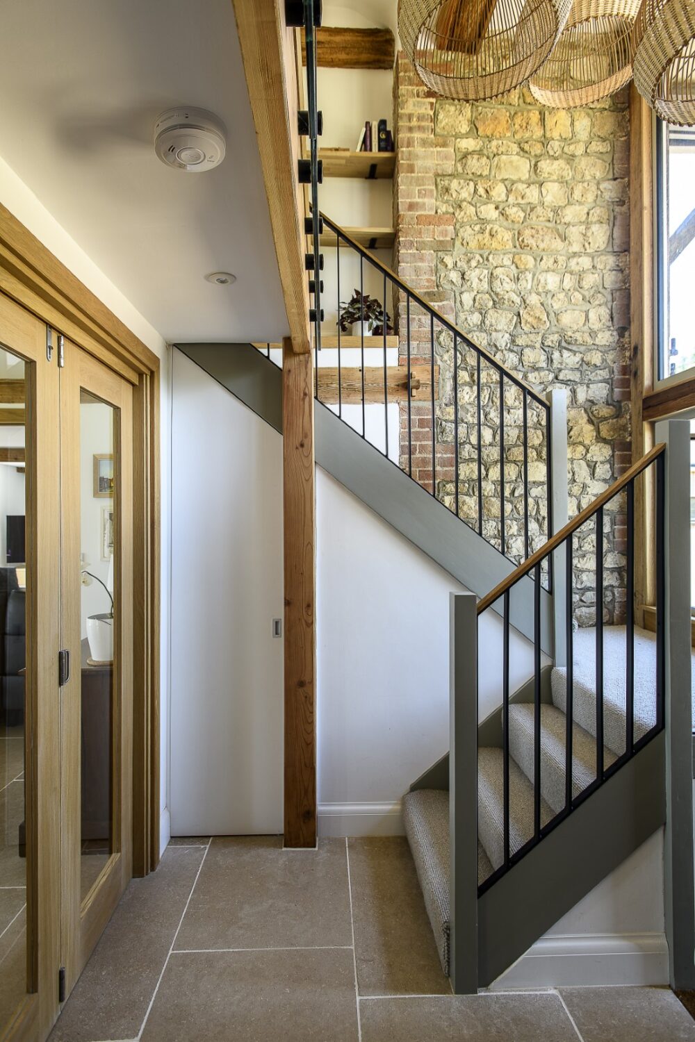 Andrew added larger windows, including huge picture panes that flood the double-height entrance hall with light