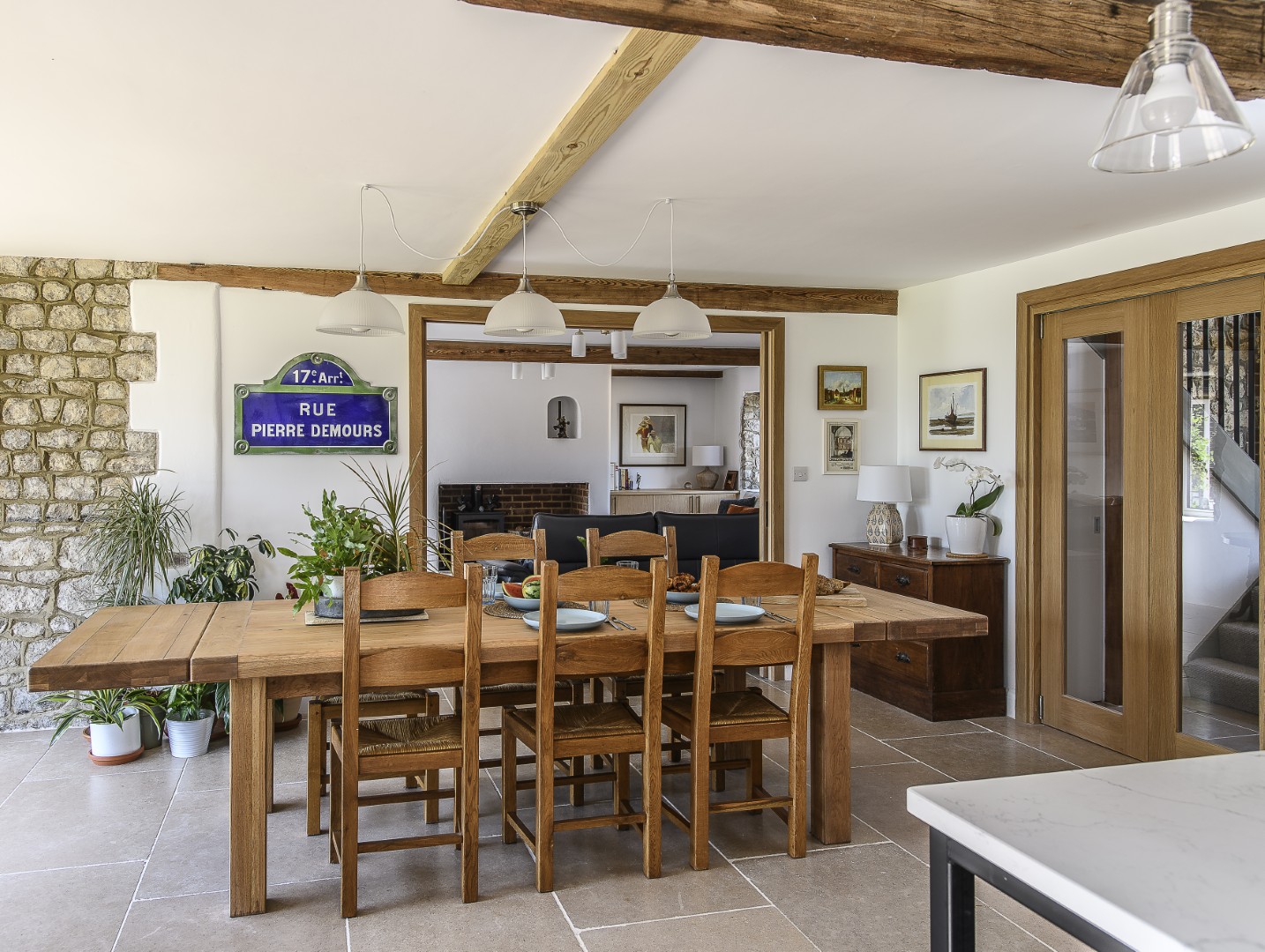 The kitchen has a decidedly French feel, with exposed ragstone walls and beams