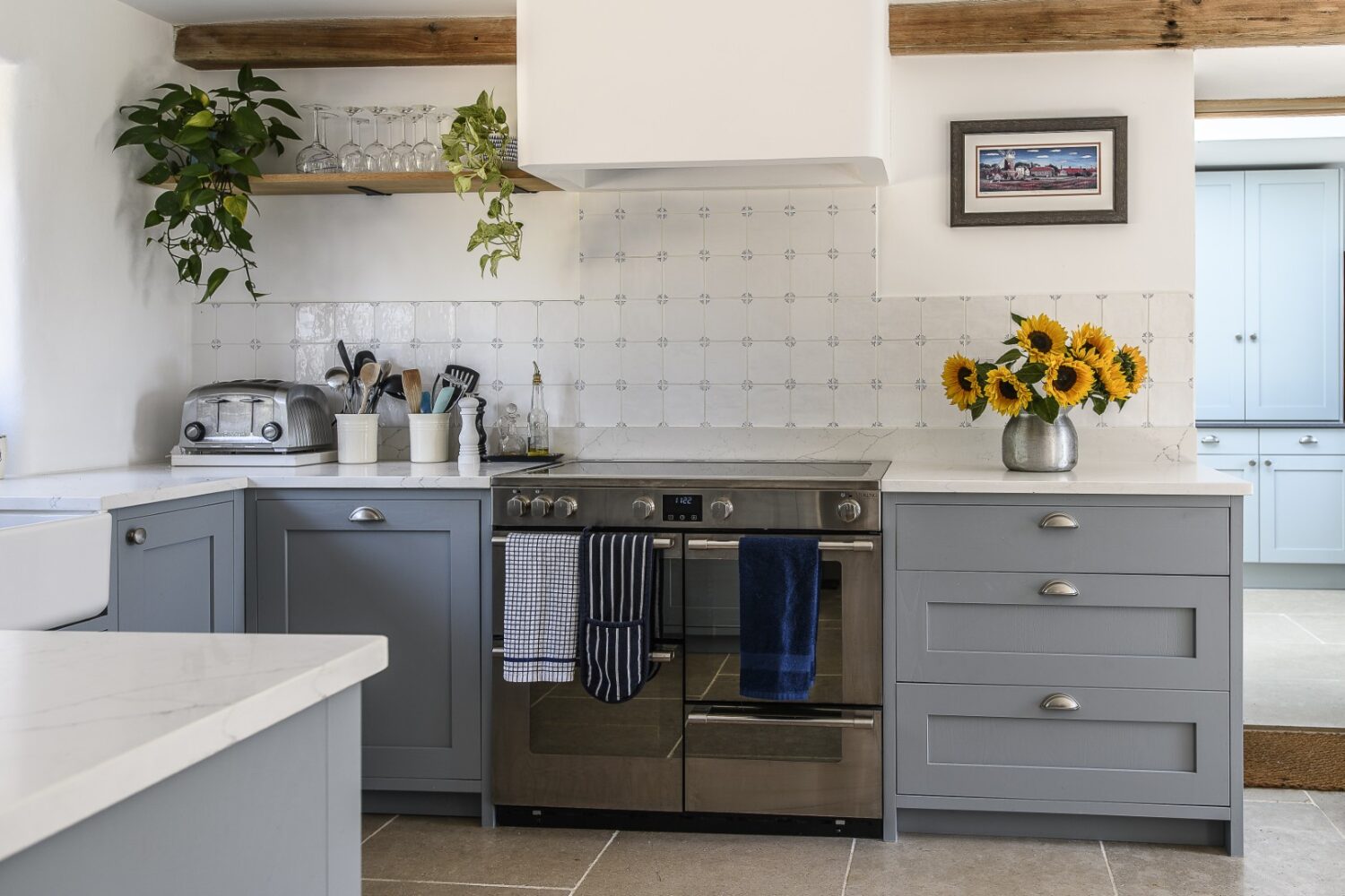 The kitchen has a decidedly French feel, with exposed ragstone walls and beams