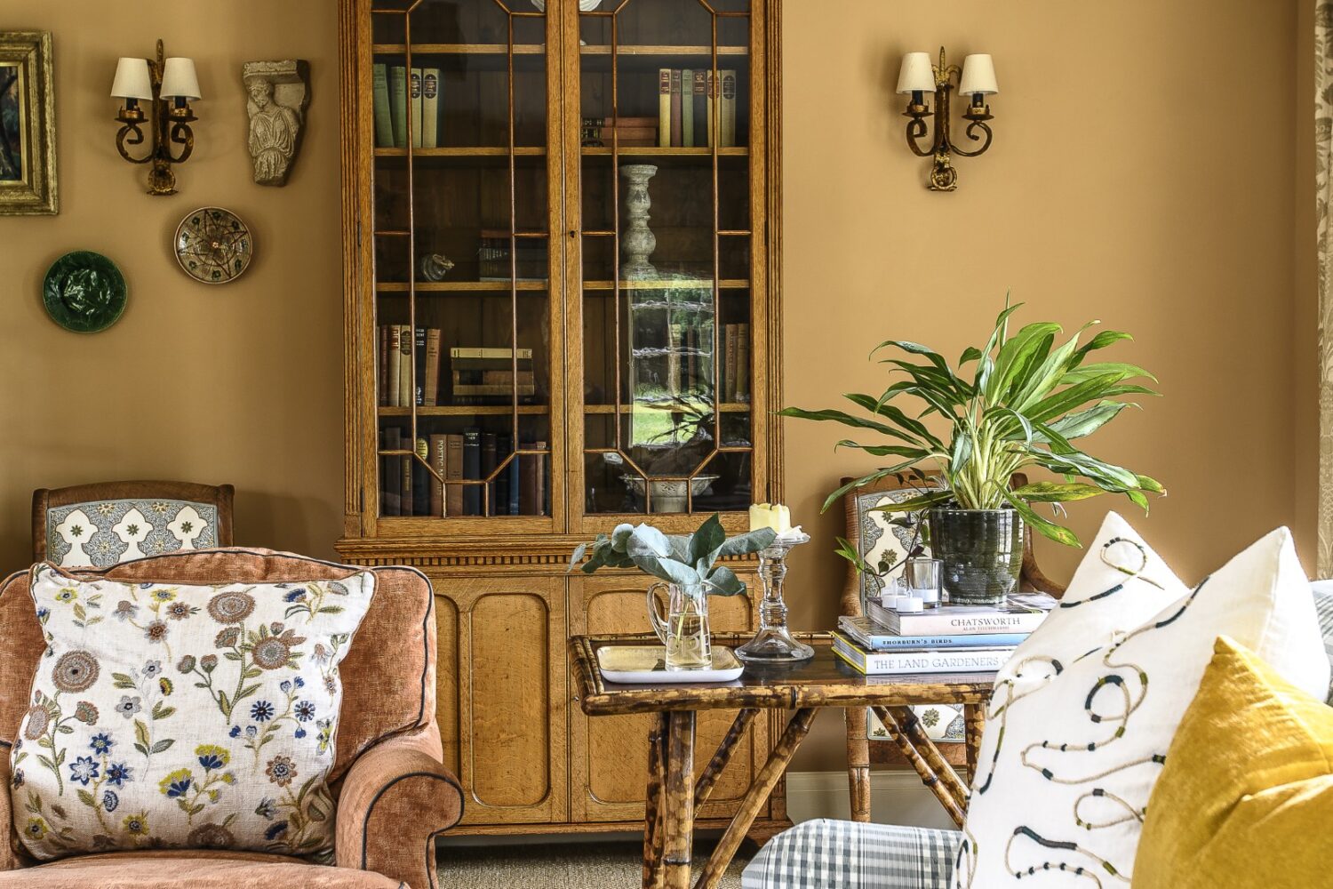 Olya softened the sitting room, a later extension, by bringing in more of a country-house feel with vintage rugs and custom covered sofas from David Seyfried