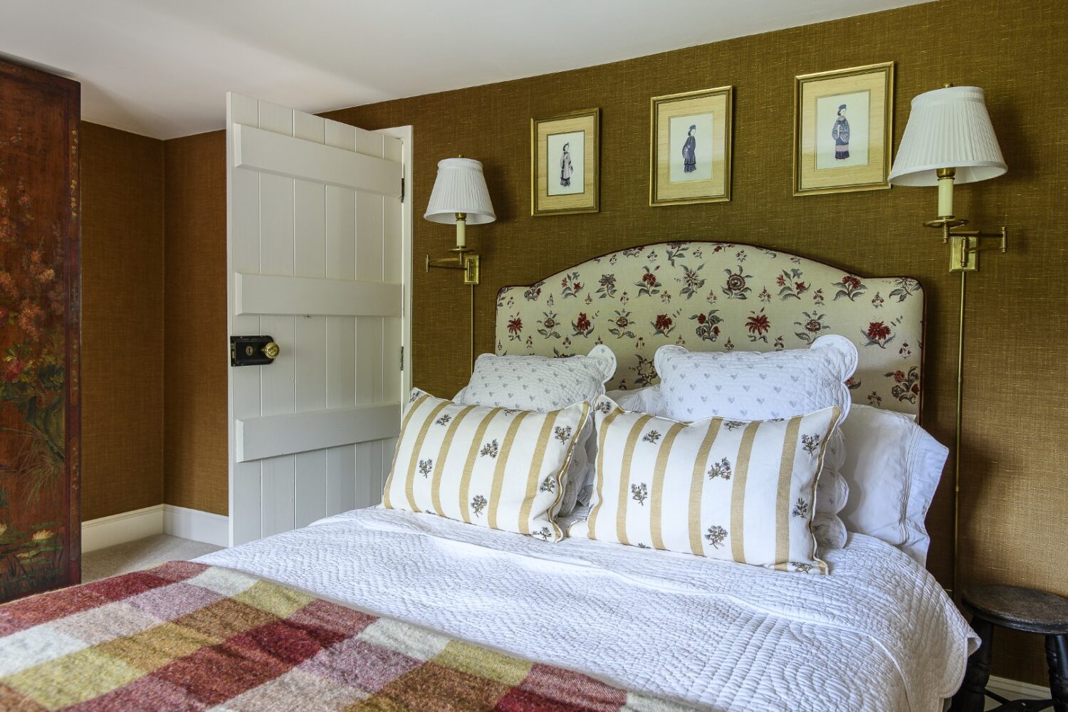 Olya has covered one of the bedroom’s walls with a rich brown Leuven Linen from Paolo Moschino. Antique wardrobe doors from Paris have been re-purposed as custom wardrobes