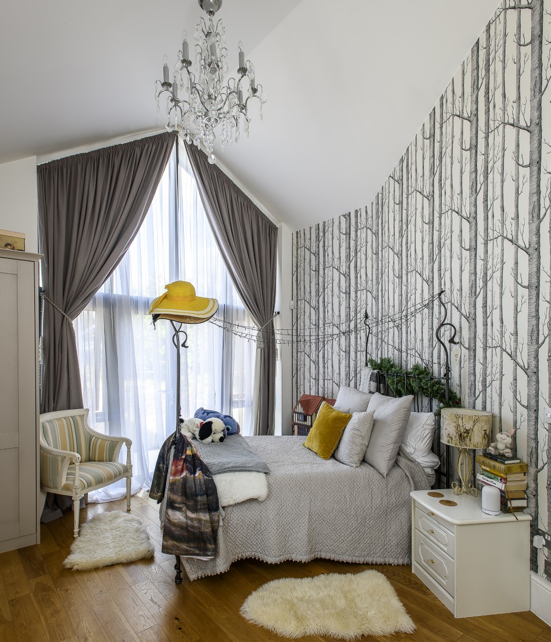 Other bedrooms each carry their own personality, with playful textures, striking wallpapers, and a warmth that makes them inviting rather than showy.