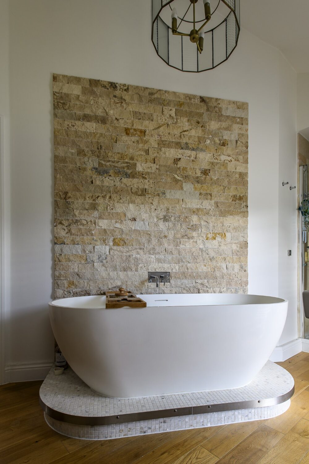 Bathrooms again show their flair for material contrasts – stone, wood and tile all playing against one another.