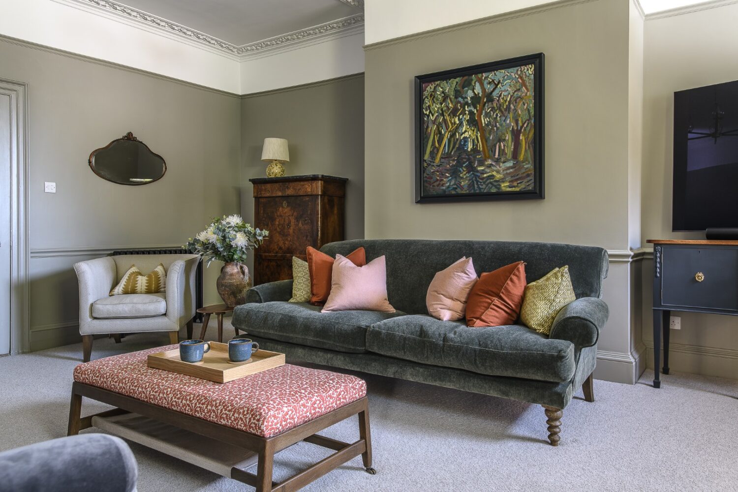 A door off the entrance hall leads to a cosy media room