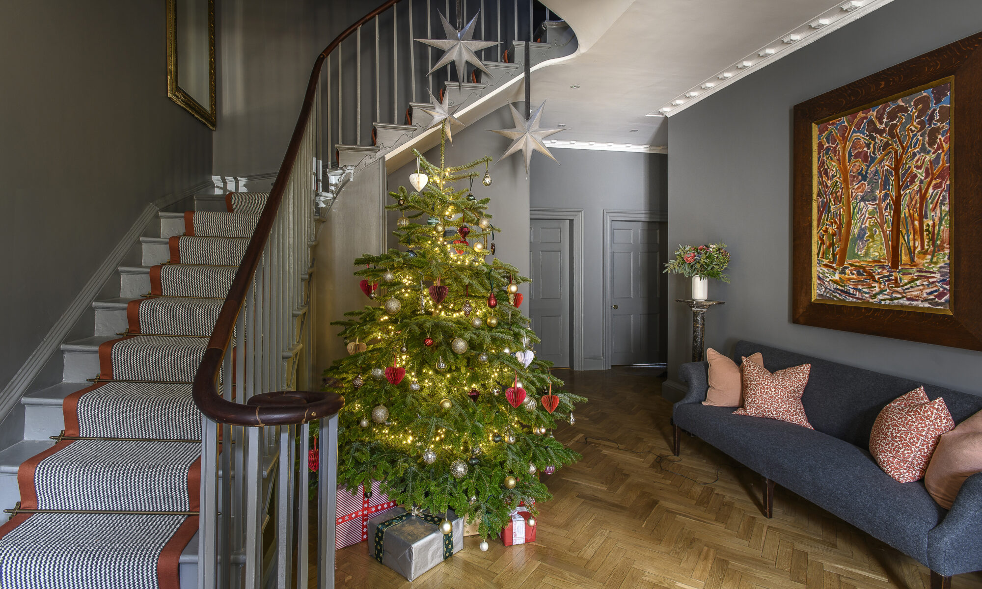Hallway with winding staircase.