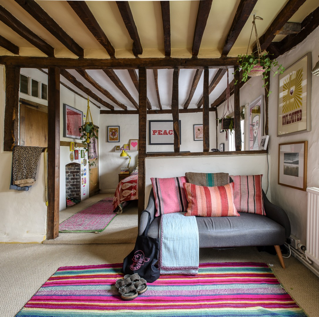 The principal bedroom, with a print by Dandy Star above the bed