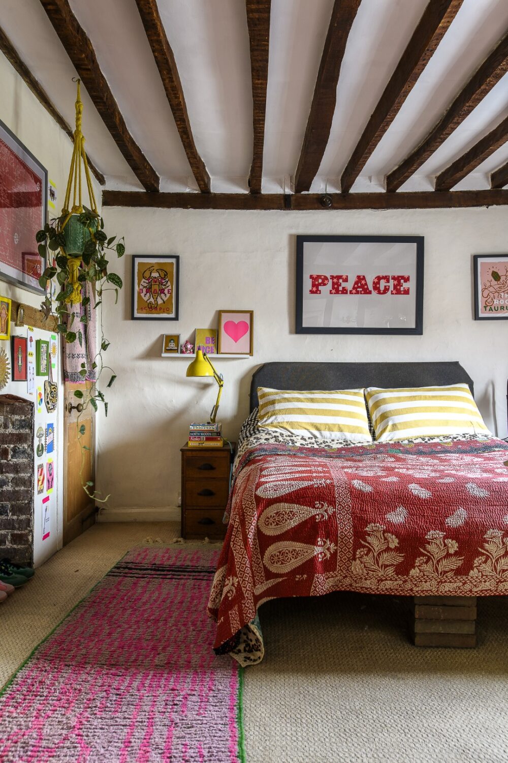 The principal bedroom, with a print by Dandy Star above the bed