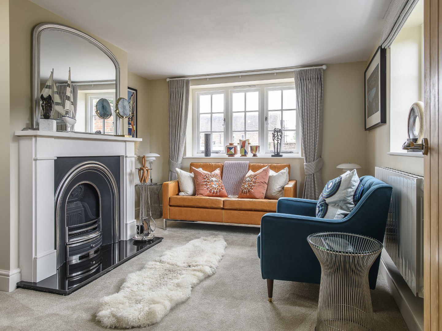 The sitting room is accessorised with Jonathan Adler soft furnishings