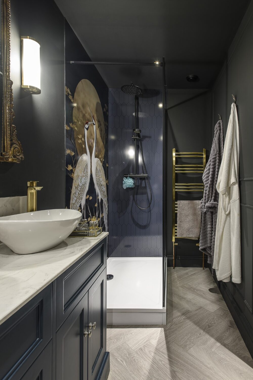 Doors in Tania’s bedroom, which look like a run of wardrobes, open to reveal her stunning en suite shower room