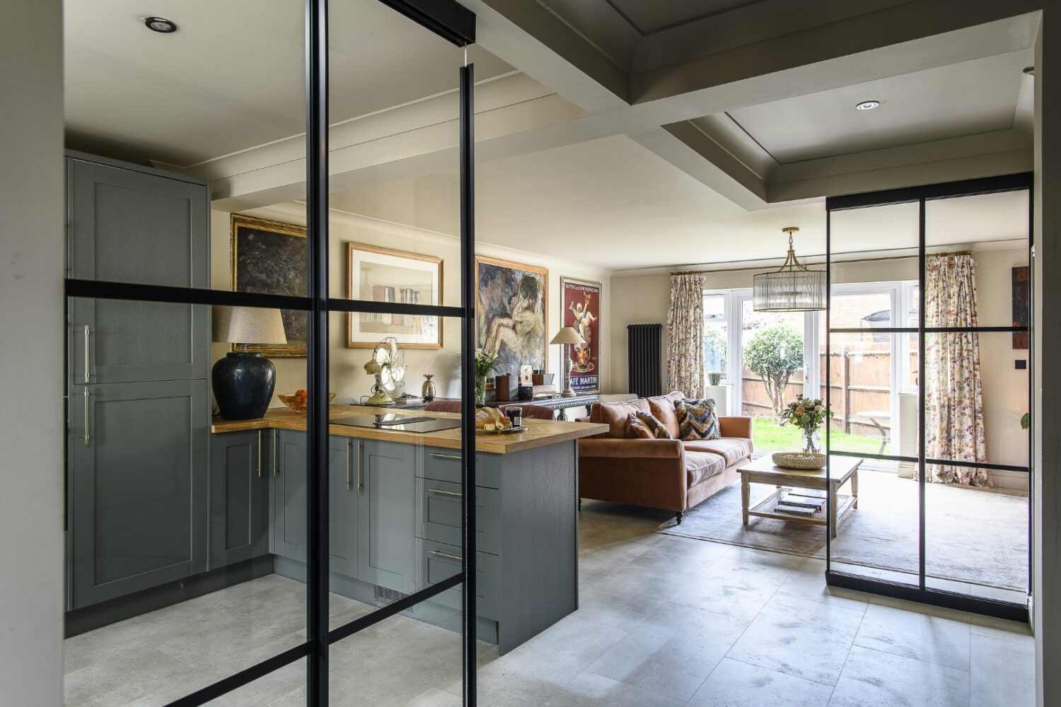 The kitchen/living space is smartly zoned with two bespoke Crittall-style glazed panels that give definition to the space without sacrificing light and flow