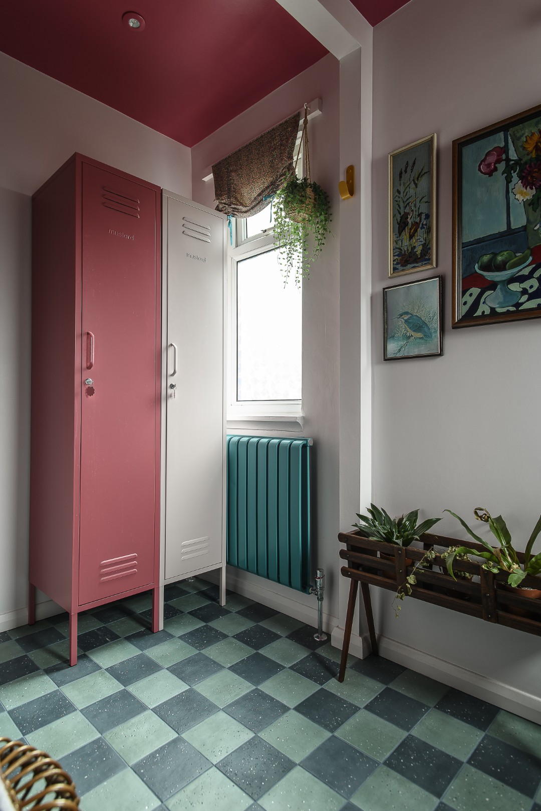 The family bathroom features Mustard Made lockers, one in a rich berry colour which is echoed on the ceiling