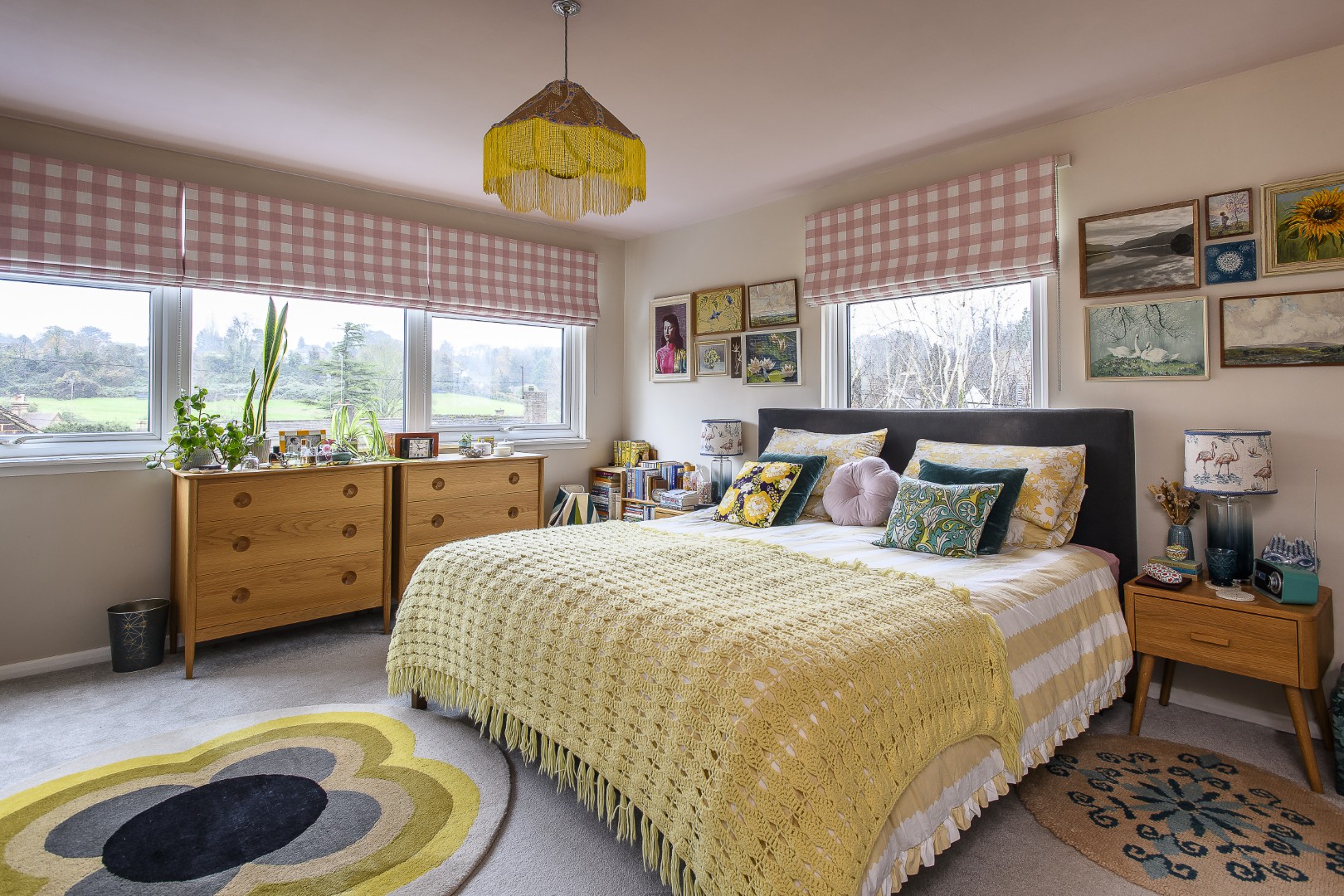 Katherine added yellow fringing to the light shade above the bed to fit with her colour scheme