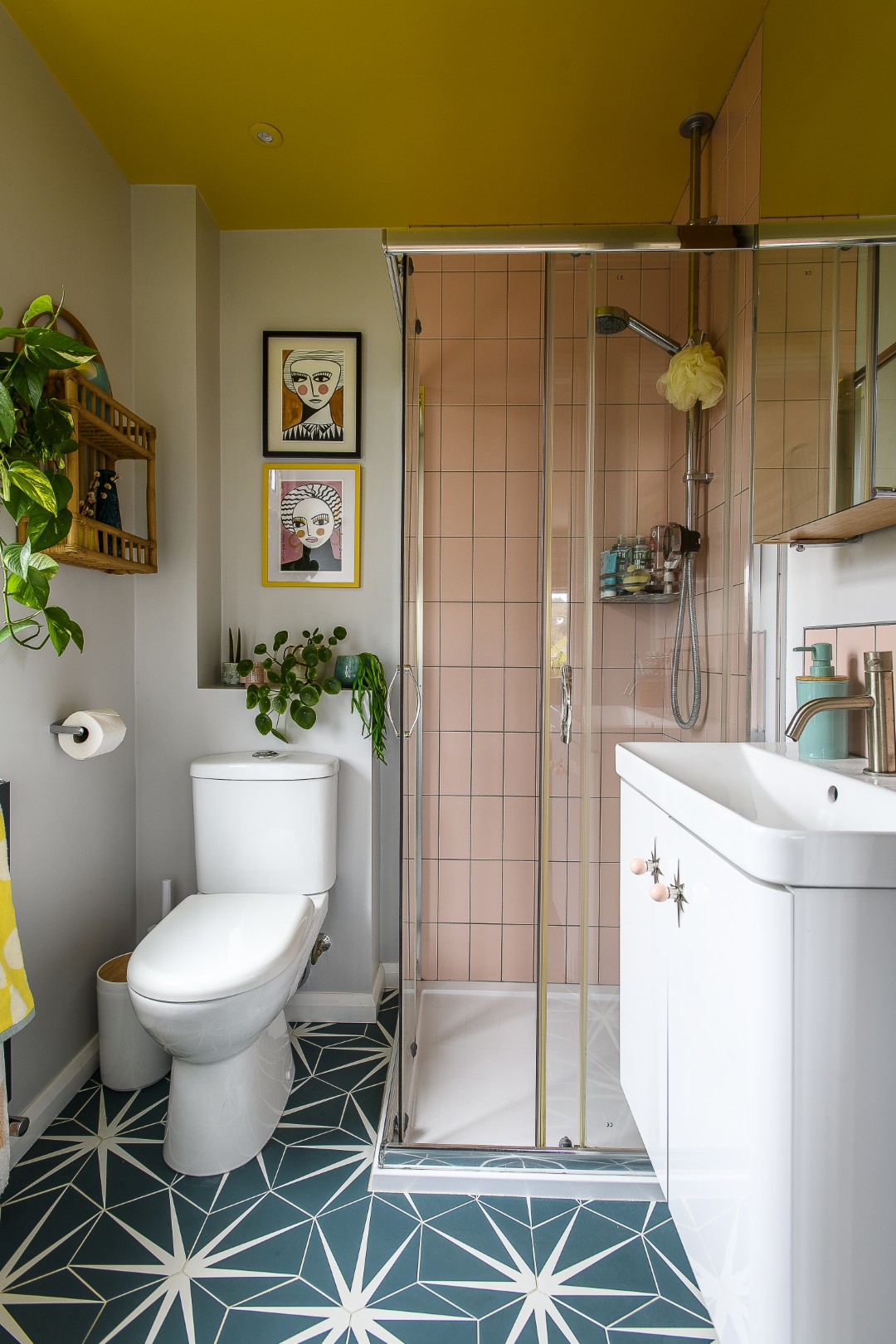 The main bedroom and en suite share a palette of dusky pinks and yellows. 