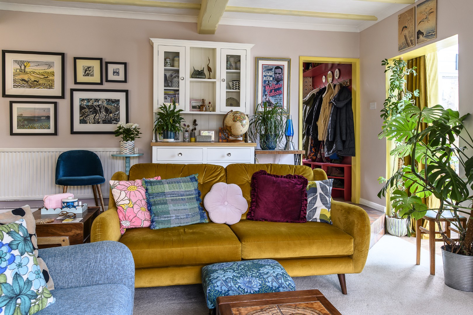 A colour palette of buttercup yellow, soft pink and turquoise work together to create a relaxing sitting room vibe. 