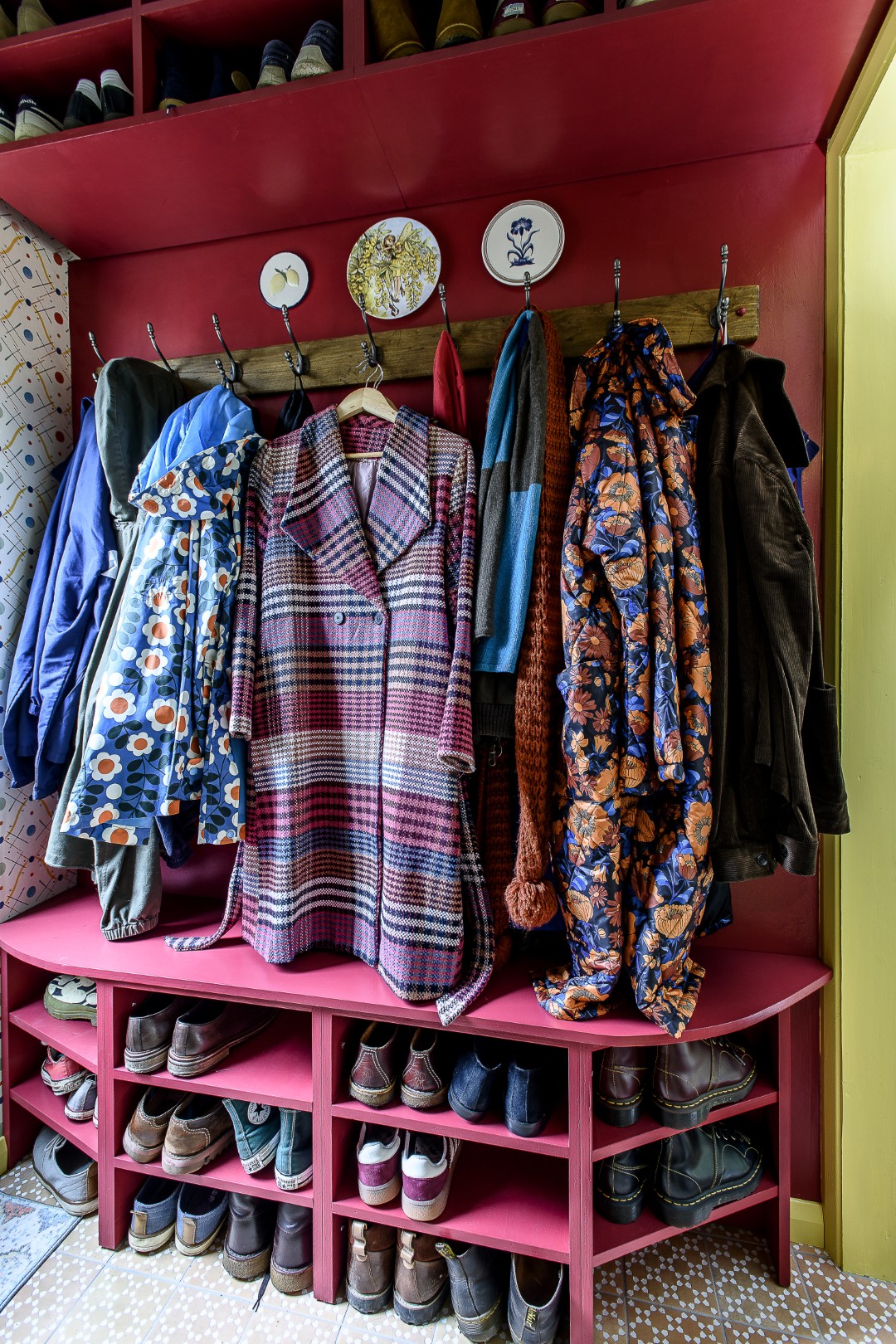 Katherine commissioned a local carpenter to create some useful shoe and coat storage.