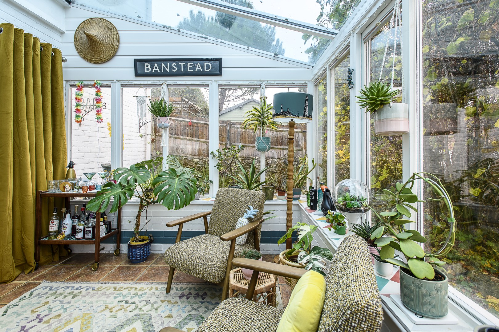 The conservatory now serves as the perfect bar and seating space. 