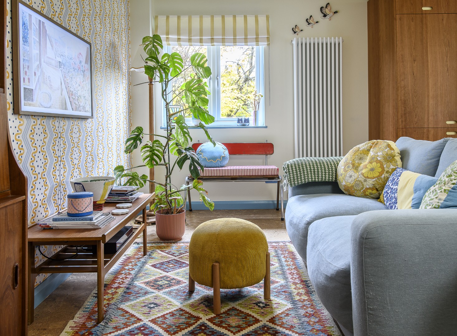 Throughout the house, midcentury furniture has been brought to life with playful pops of colour.