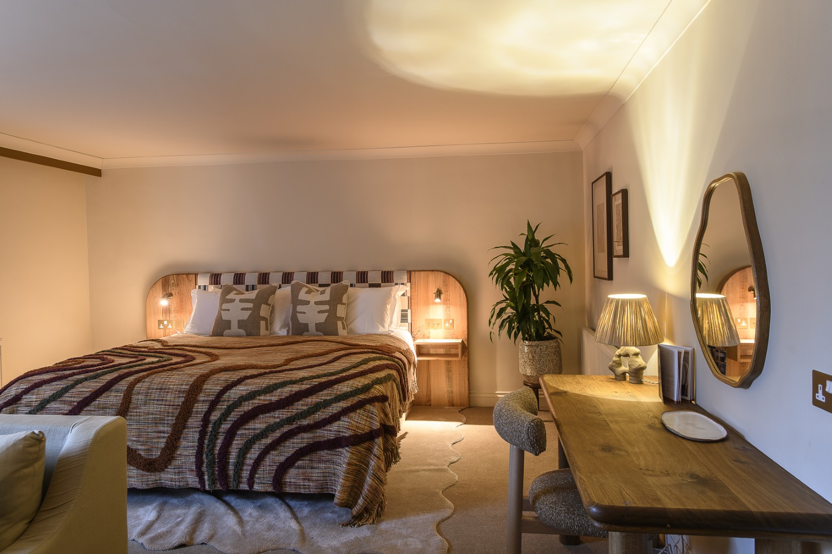 The softly lit and spacious Junior suite has views out over the lawn, towards the lake