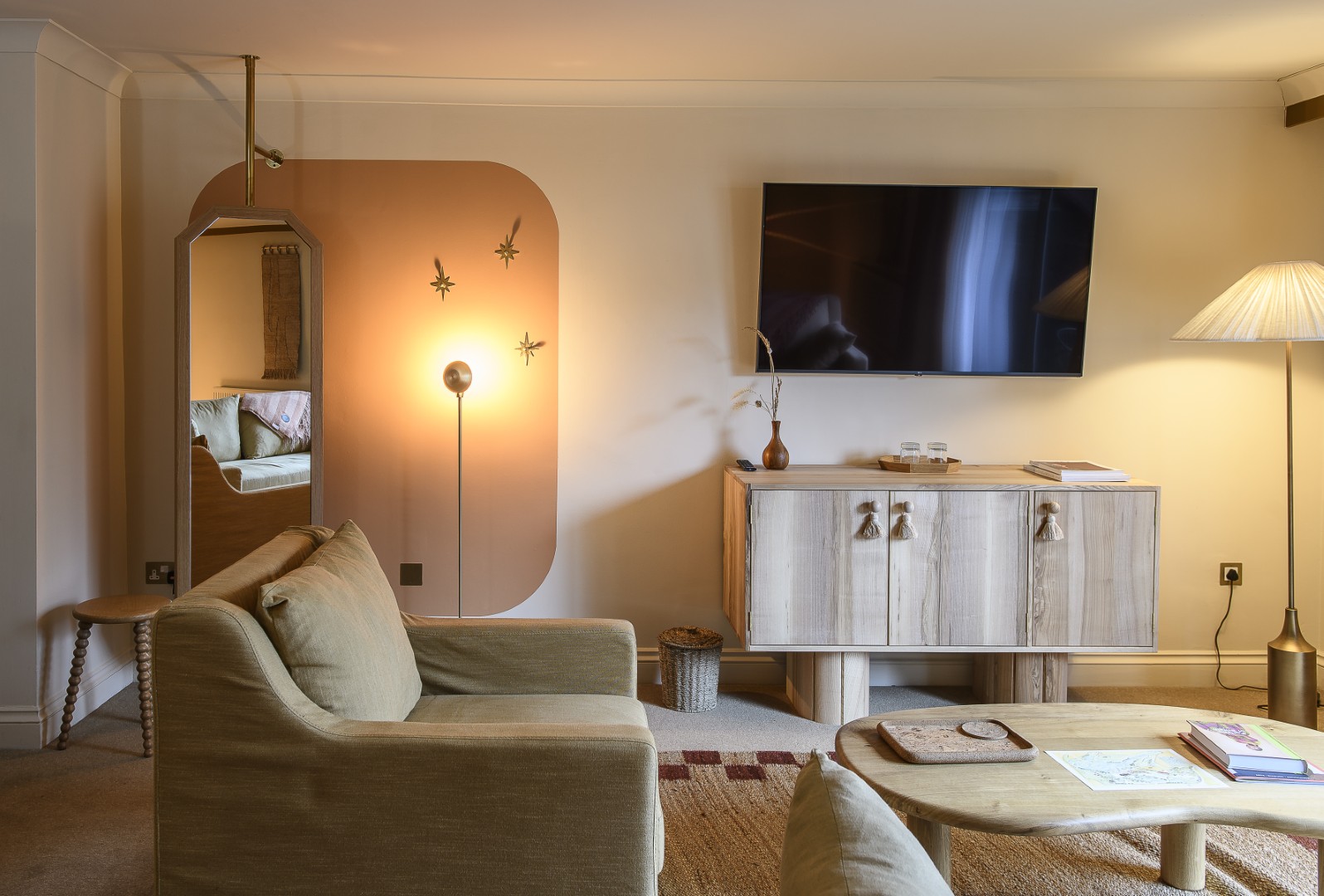 The softly lit and spacious Junior suite has views out over the lawn, towards the lake