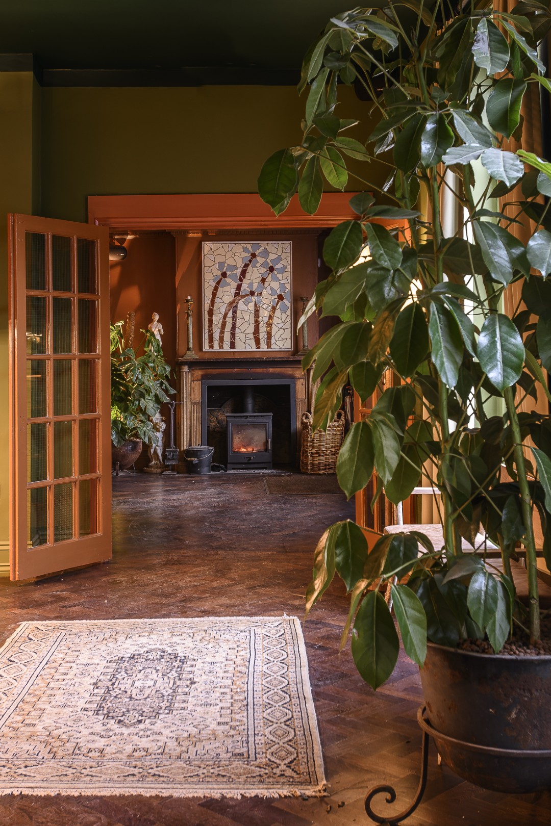 The entrance hall and reception desk, with an alcove showcasing some of the ceramics created by local artists