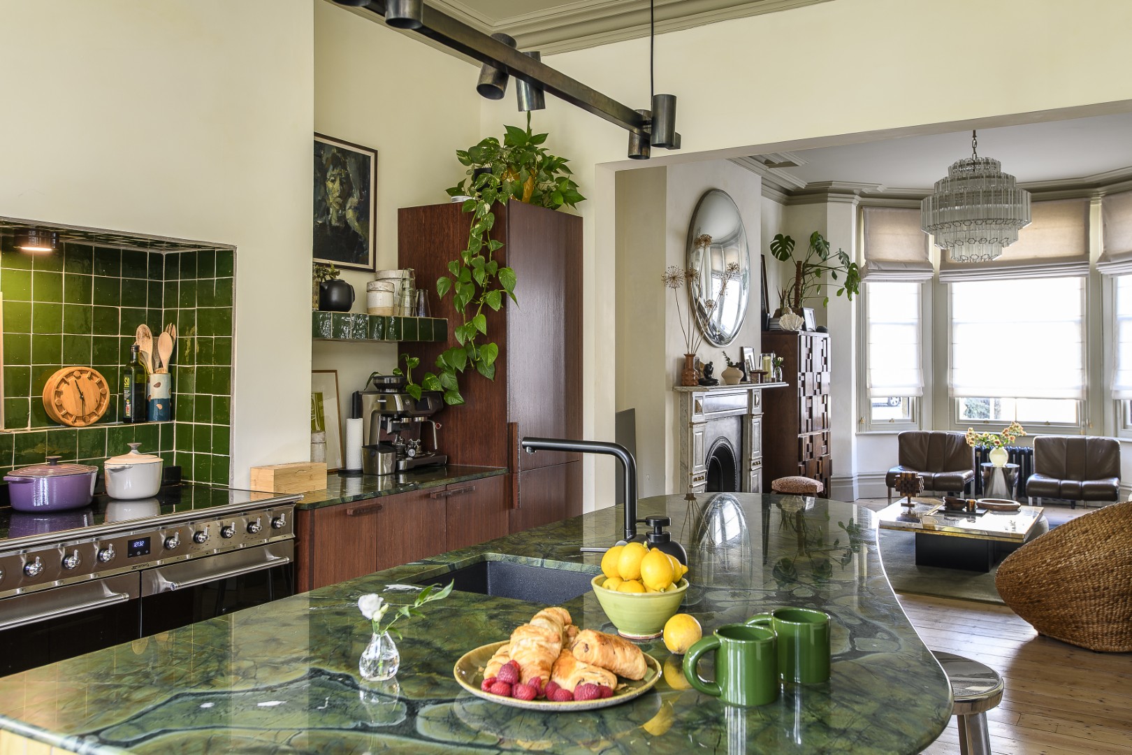 The dramatic dark green Brazilian quartzite that Laura and Jonathon chose for the worksurfaces features wonderful veining of petrified tree trunks