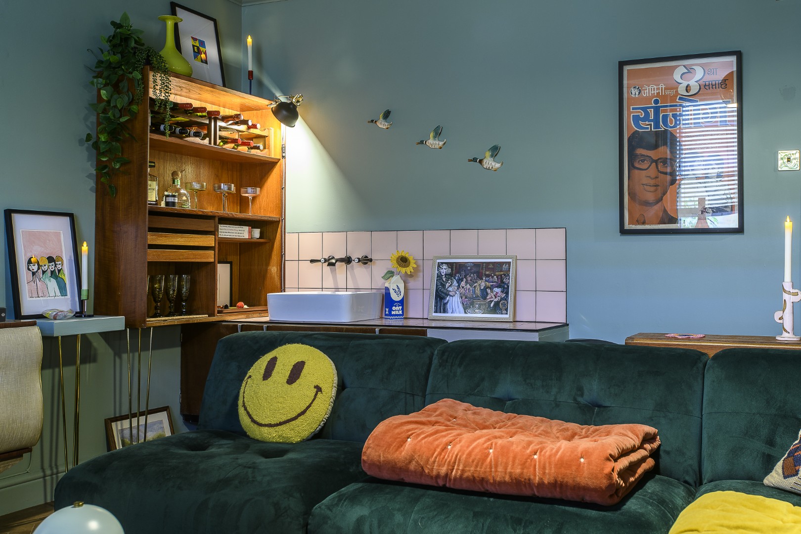 A small bar is tucked into one corner of the sitting room, alongside a small sink.