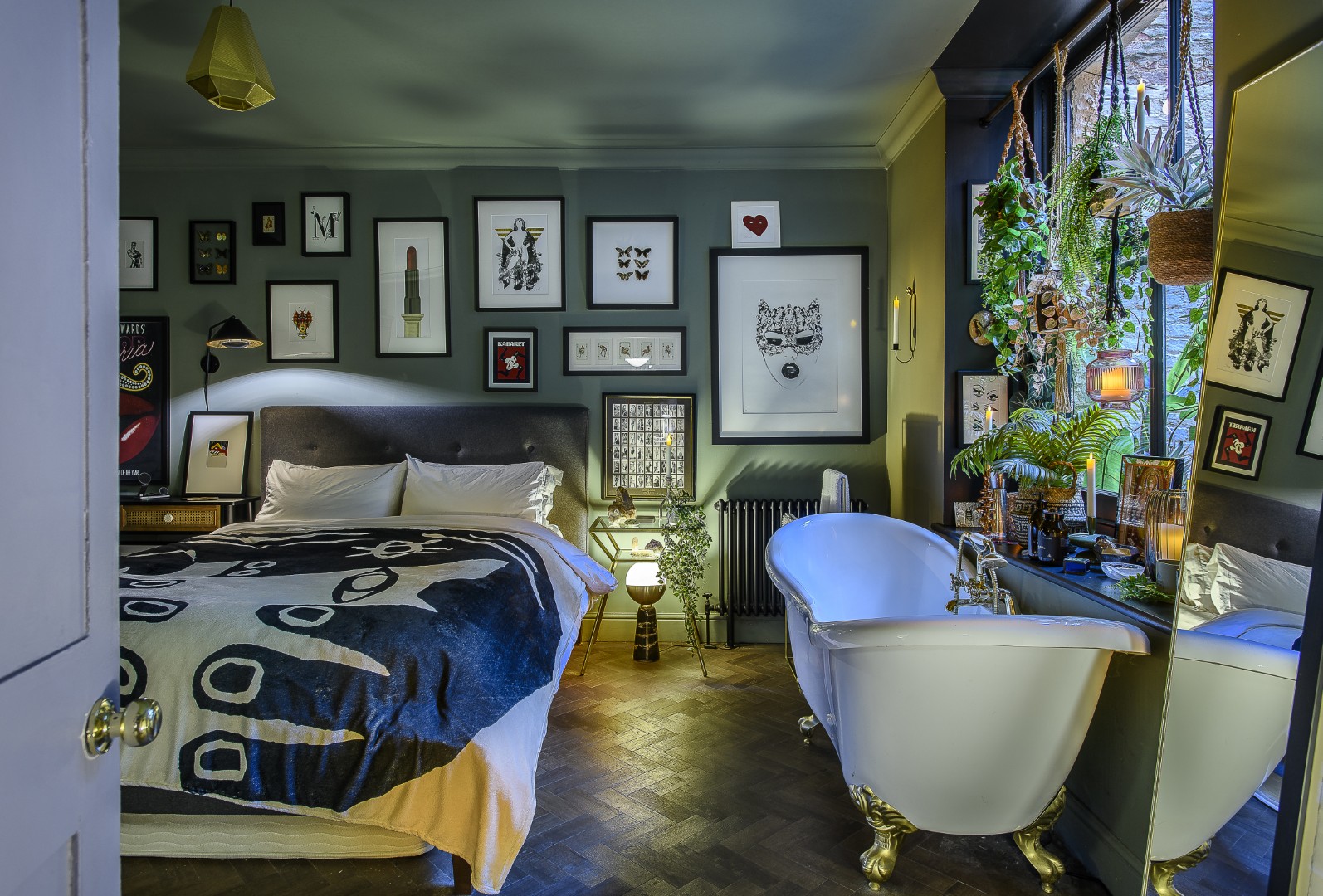 Matt’s bedroom is a tranquil and inviting space, filled with artworks and plants. His stunning bath looks out into the pretty courtyard garden that’s laced with festoon lights.
