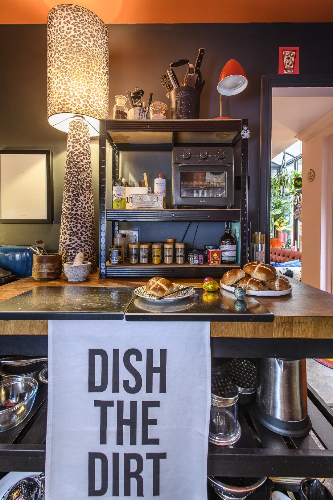 The kitchen is deep orange and black, set off by white splashback tiles. This fun space is where so many Dept of Joy items can be found. “My approach to interiors is not about filling your house with stuff, it’s about choosing pieces that make you smile when you walk past them,” Matt says