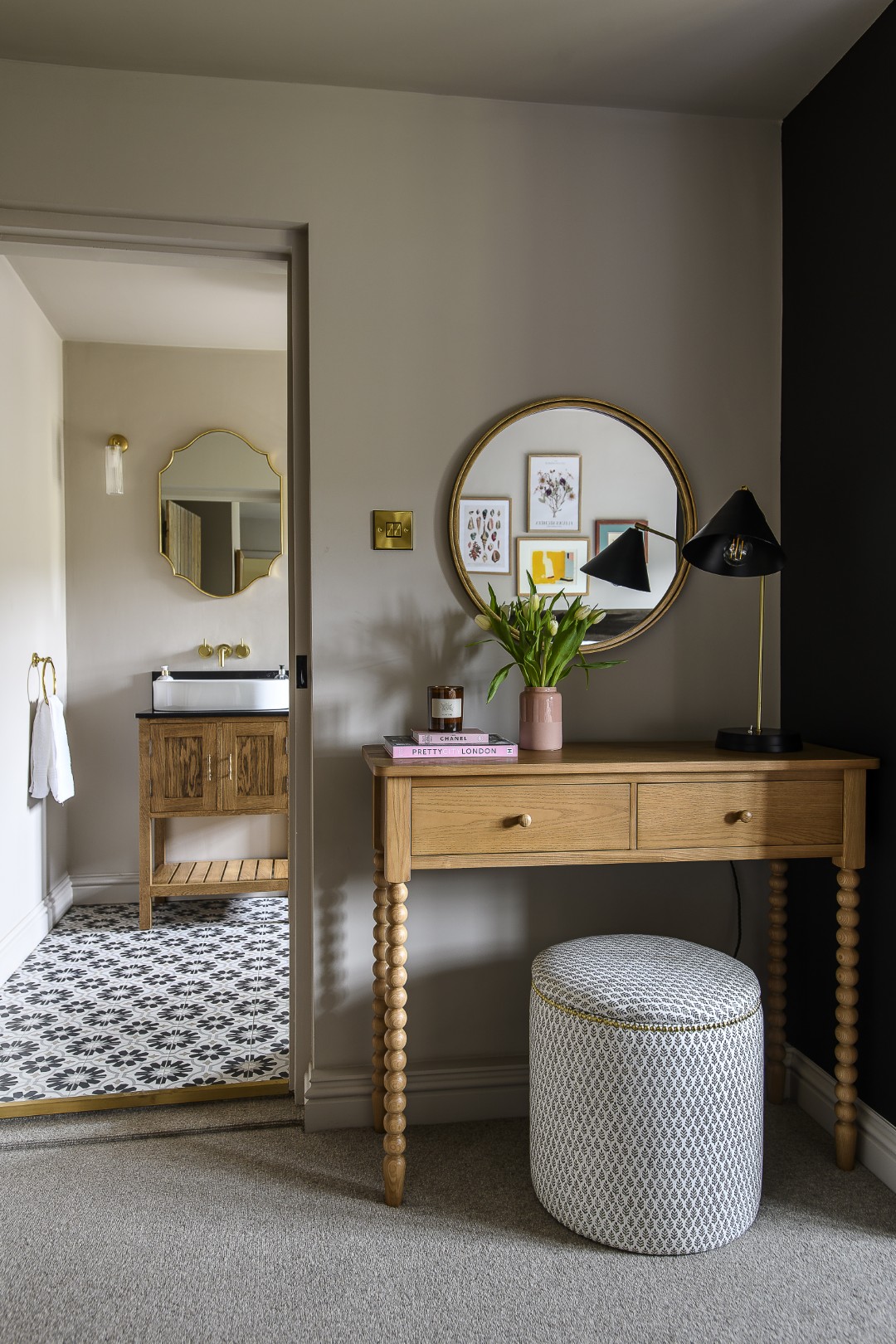 A small dressing table perfectly fits the space