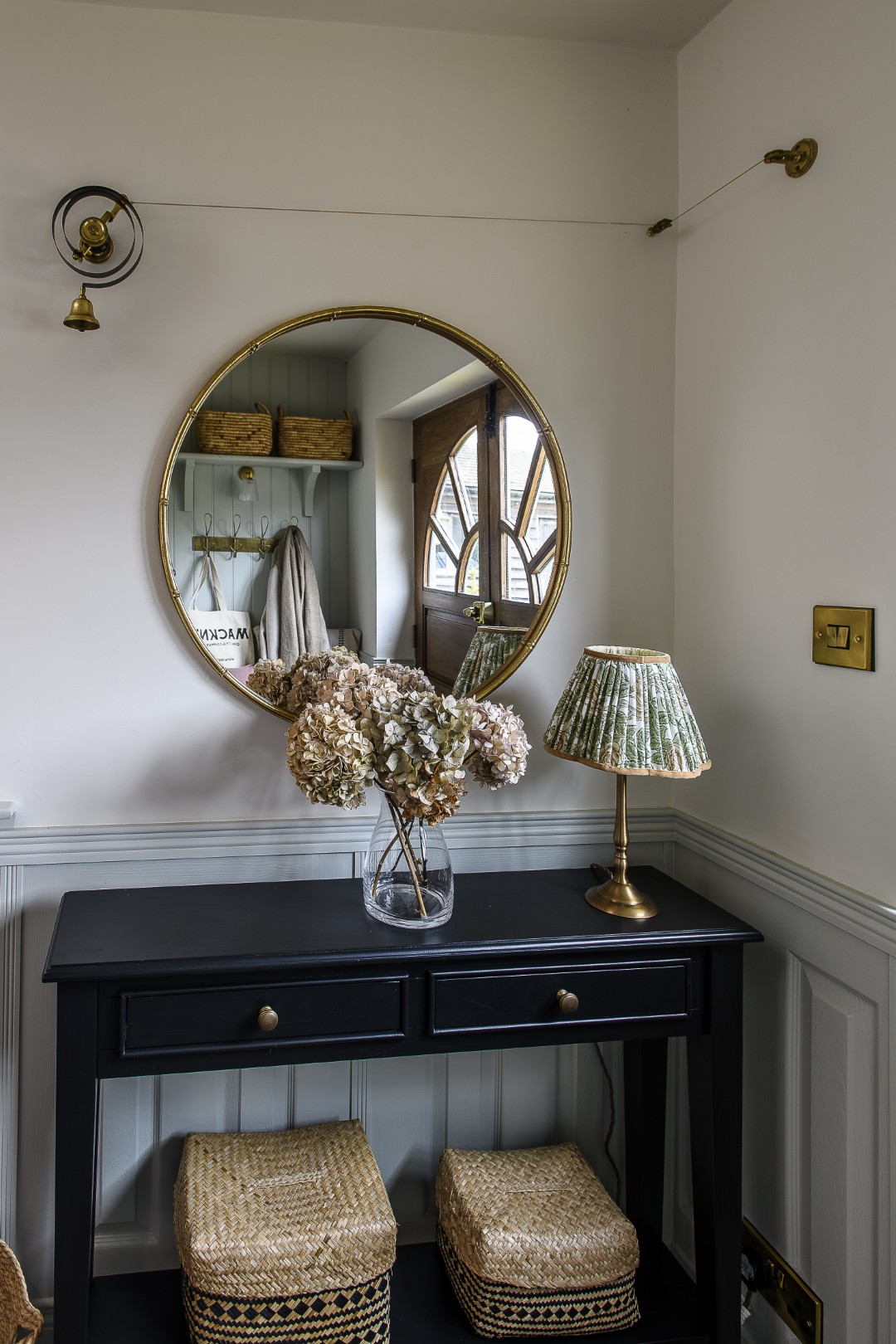 A smart, spacious entrance hall features plenty of storage for coats and shoes