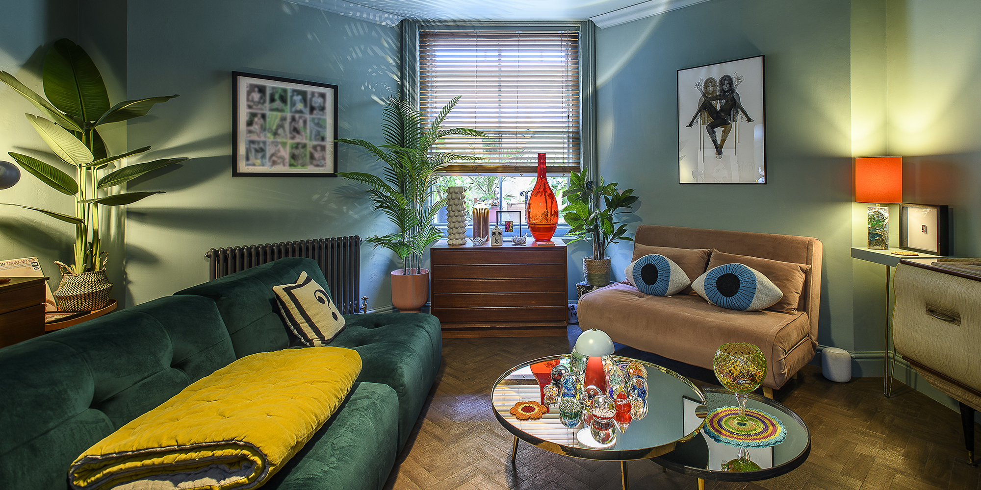 In the sitting room a velvety teal corner sofa anchors the cool blue-teal scheme.