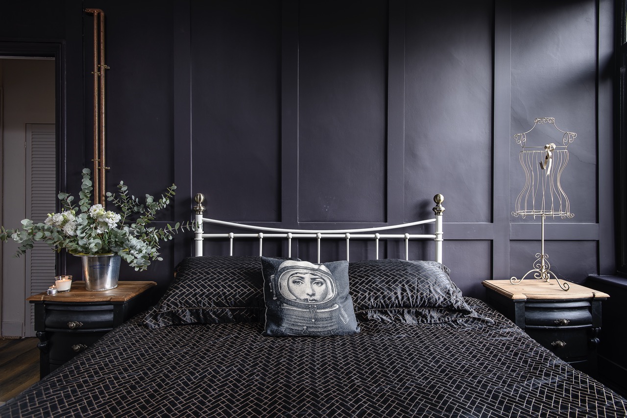 A second guest bedroom continues similar tonal expressions as the master bedroom.