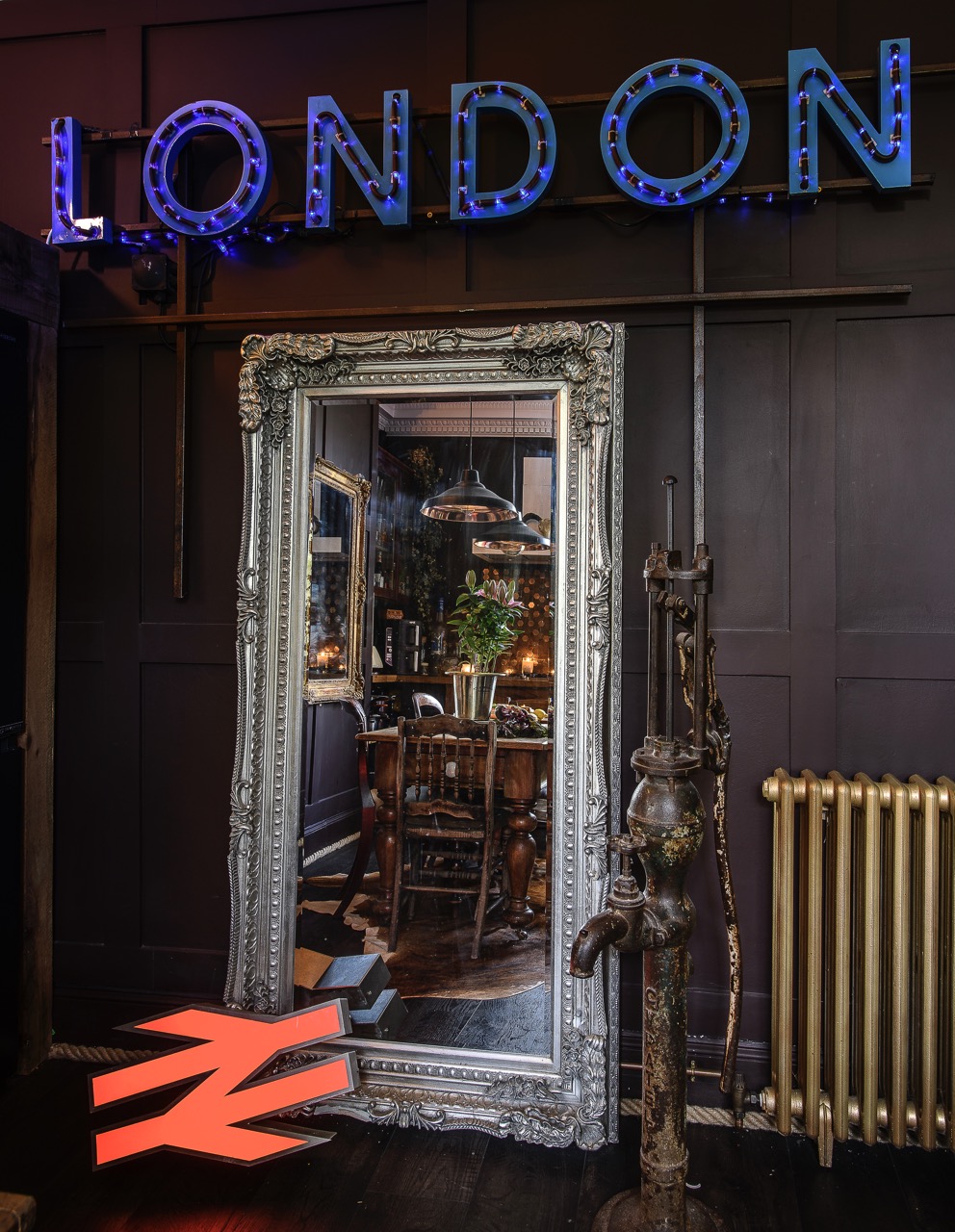 Antique shop finds and vintage signs, as well as various lighting pieces, inject industrial charm.