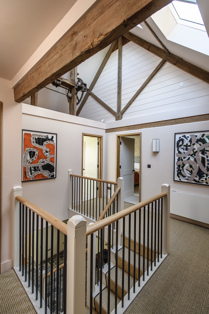 A door off the first floor landing – with paintings by Danish artist Mogensen Lopez – opens to another guest bedroom.