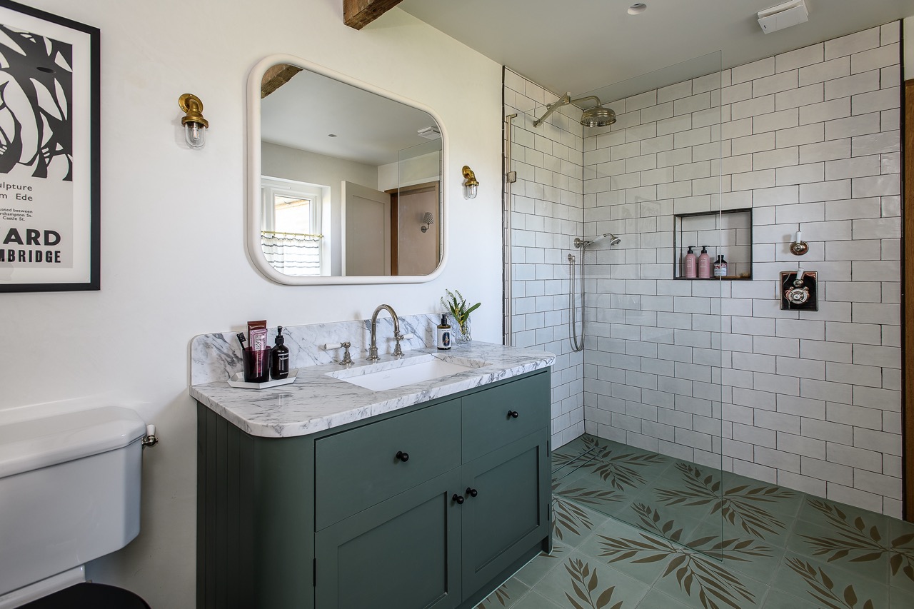 Bathrooms throughout the house are carefully considered, uncluttered spaces with luxe finishes and texture and interest provided by mixing a variety of tile materials and patterns