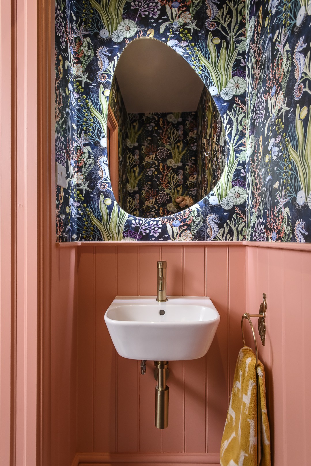 In the loo, wallpaper from Lust Home adds a playful touch when combined with Dulux ‘Sublime Salmon’ paint