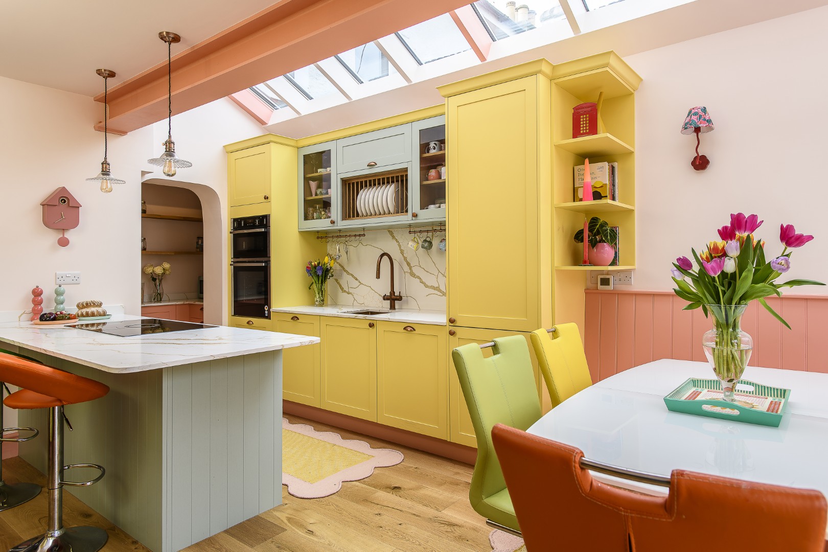 An archway leads to a useful, and very accessible pantry area.