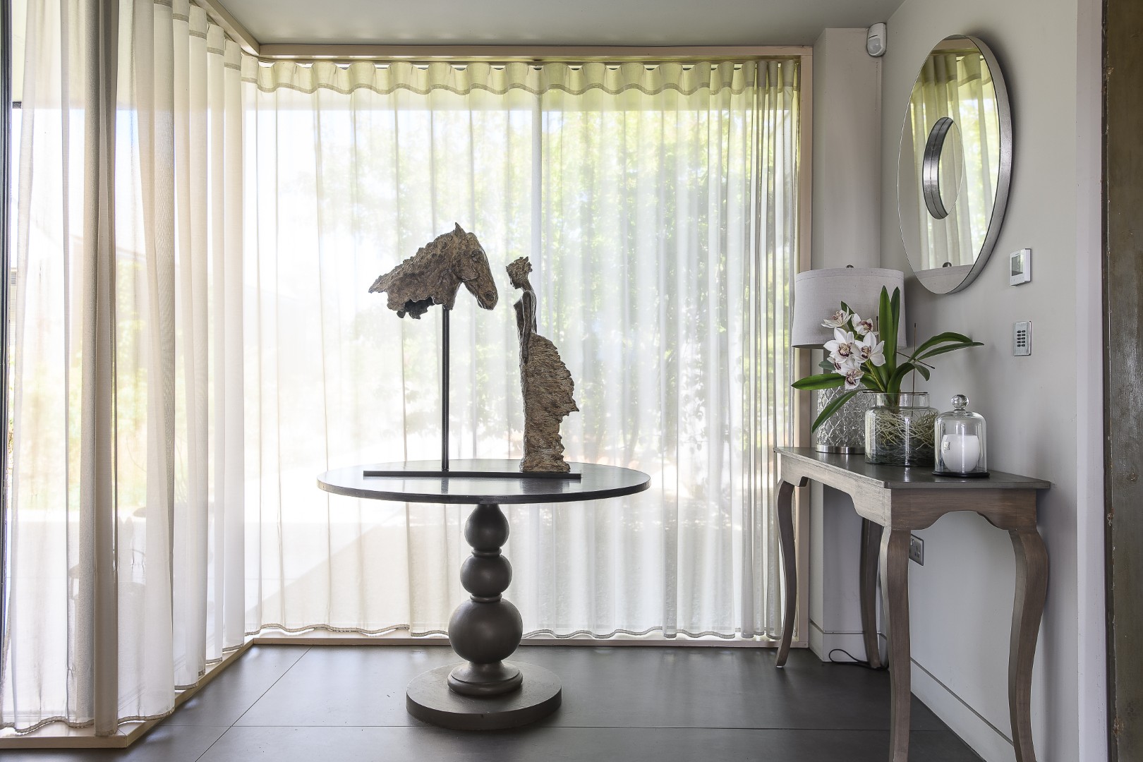 Sheer voiles diffuse light throughout the house.