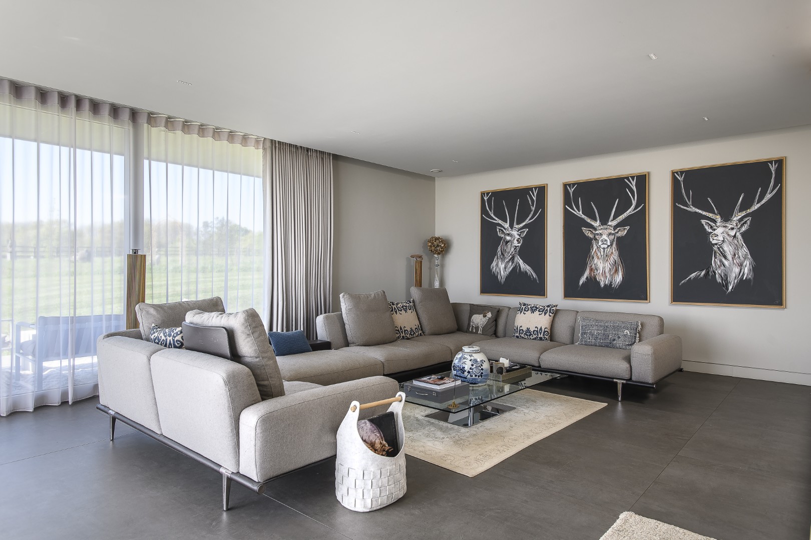 In the sitting room, a modular Poltrona Frau sofa offers both flexibility and comfort, its adaptable backrests allowing the space to shift.